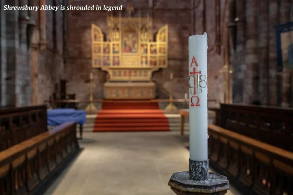 Unlit candle inside Shrewsbury Abbey, Shropshire - history of Shrewsbury Abbey