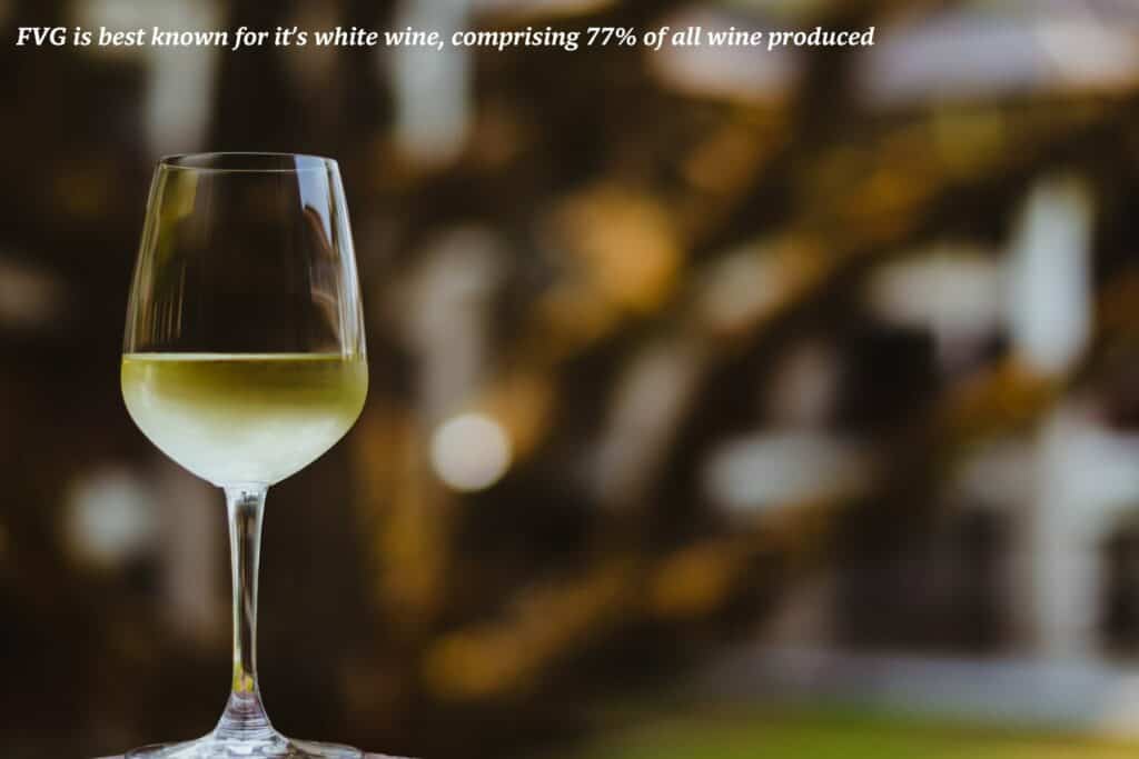 Crisp glass of white white with a blurred background - culinary guide to Friuli Venezia Giulia